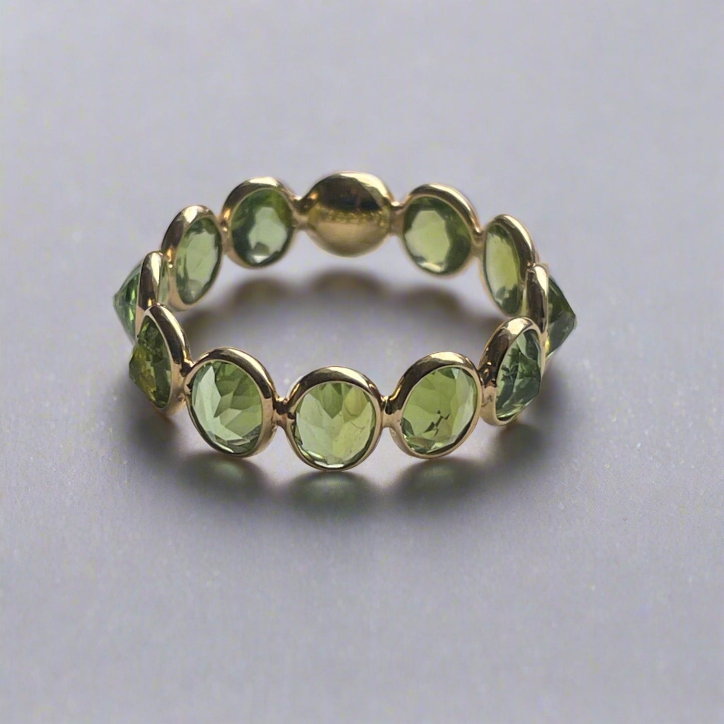 18K Gold Oval Peridot Eternity Band